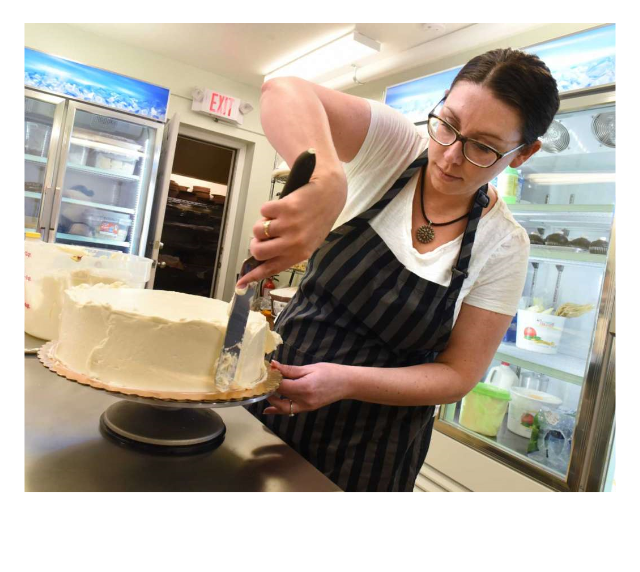 Woman decorating cake