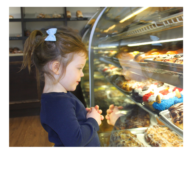 Little girl looking at display case